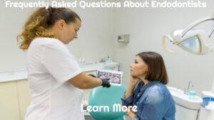 female endodontist explaining dental x-ray to female patient